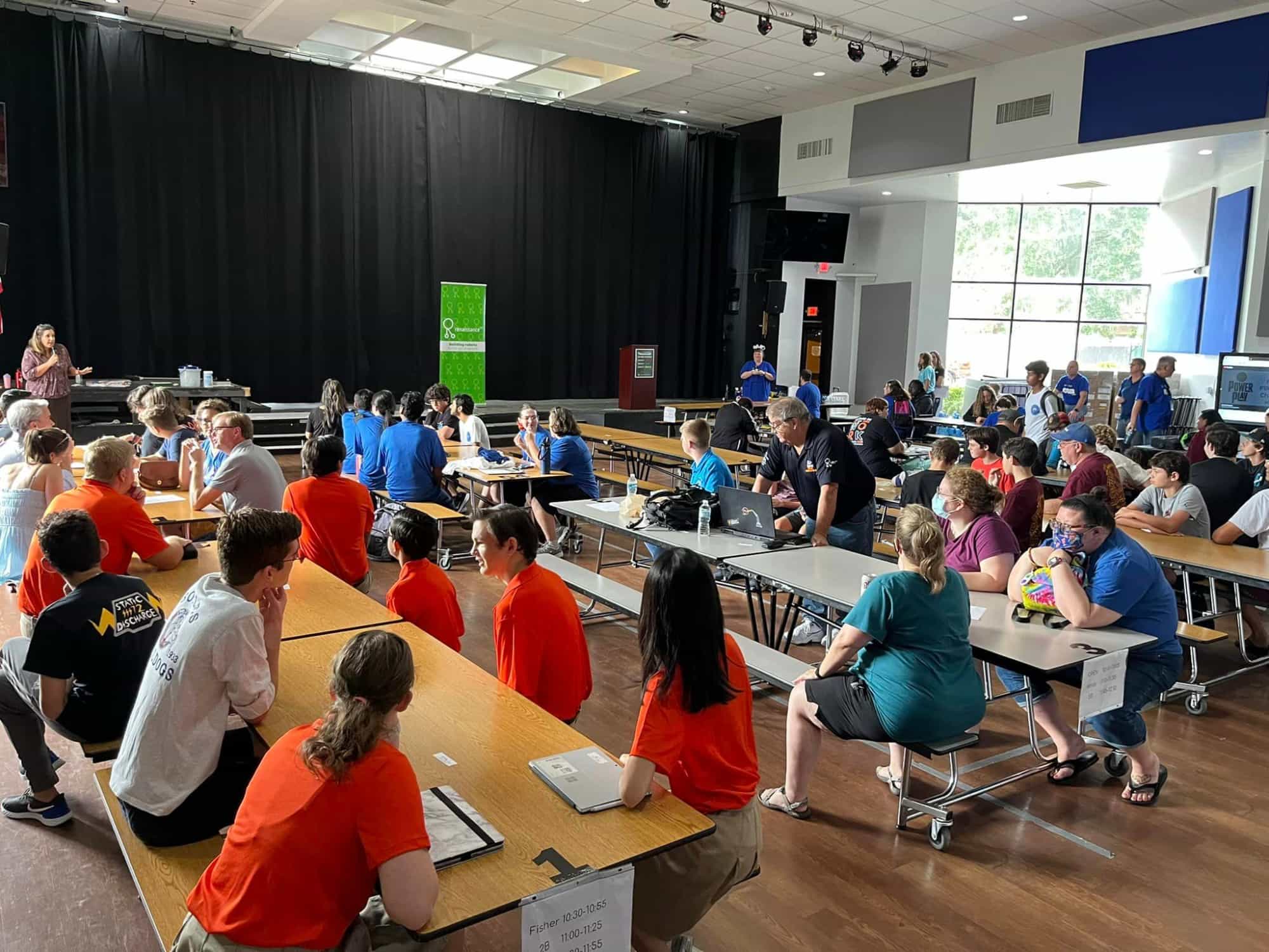 a group of people sitting at tables