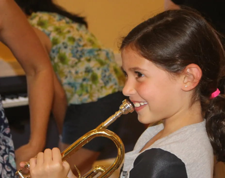 a girl playing a saxophone