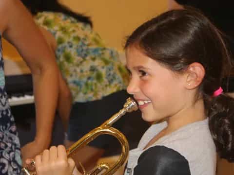 a girl playing a saxophone