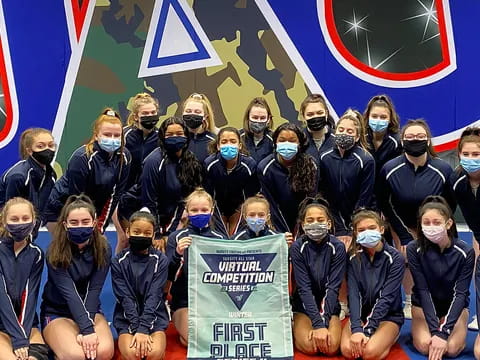 a group of people wearing blue and black with white masks and blue shirts