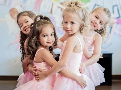 a group of girls in dresses