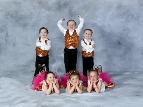 a group of children posing for a photo in the snow