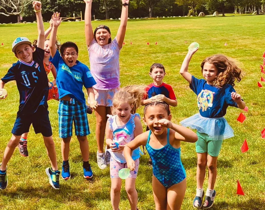 a group of children jumping in the air