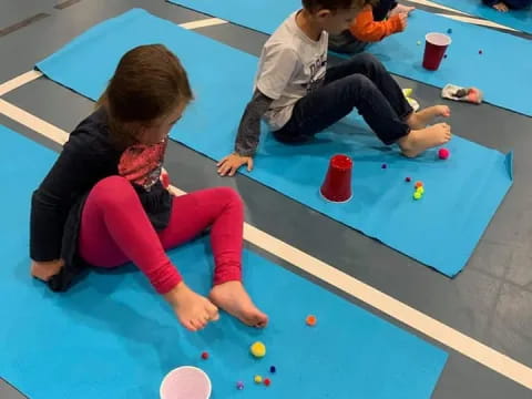 a group of children playing on a mat