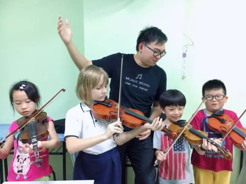 a group of kids playing violin