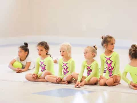 a group of children sitting on the floor