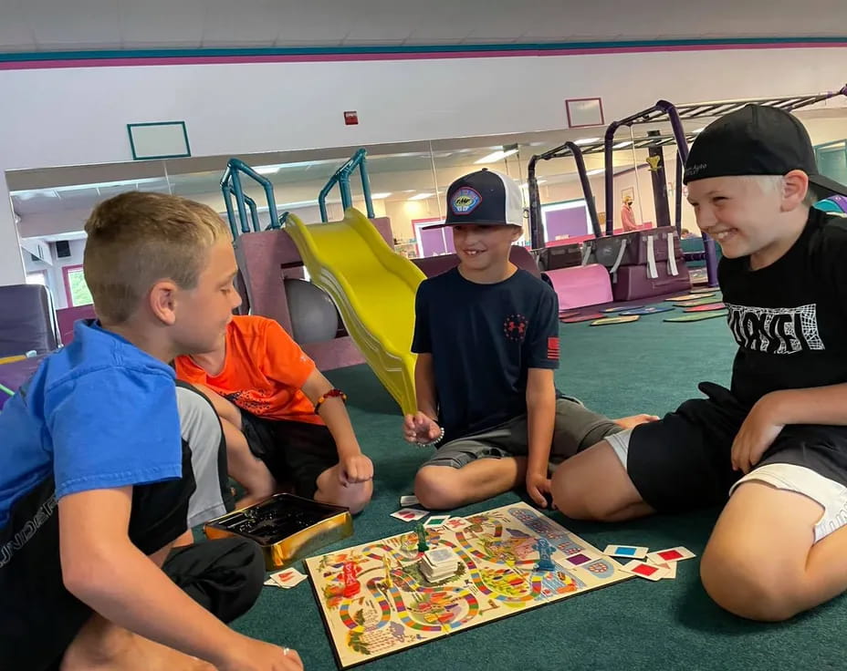 a group of boys playing a board game