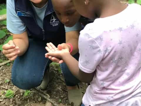 a few children planting seeds
