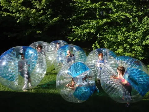 a group of people in a circle with bubbles