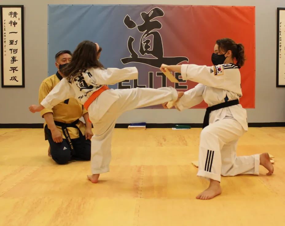 a group of people in karate uniforms
