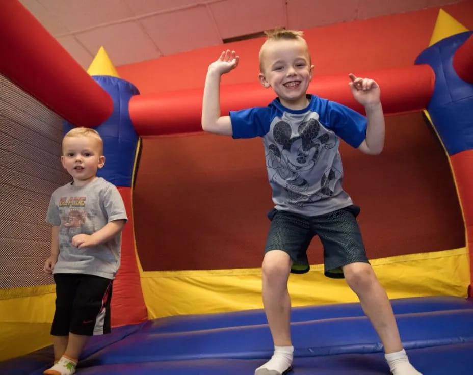 a couple of kids in a play area