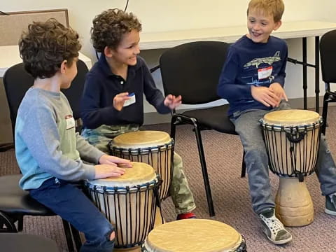 a group of kids playing drums