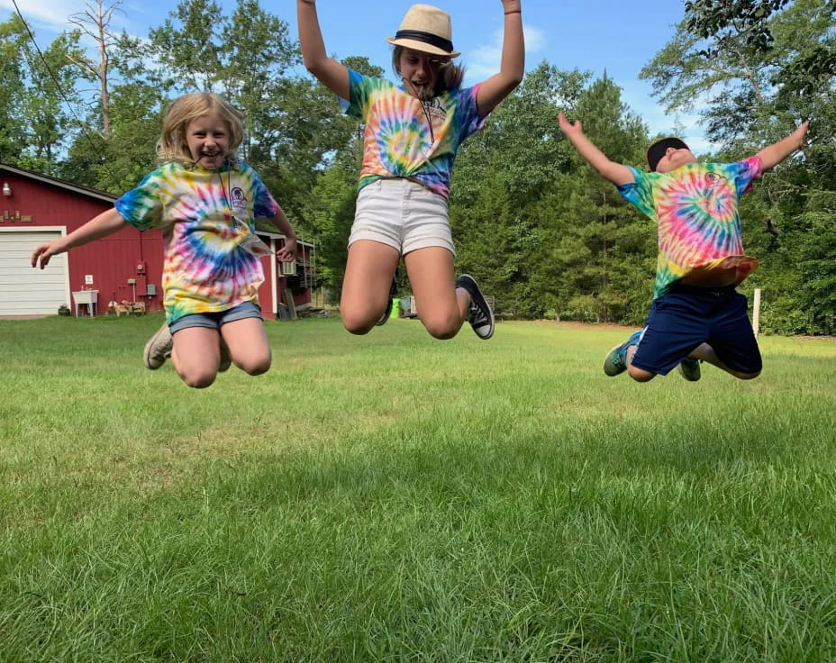 a group of children jumping in the air