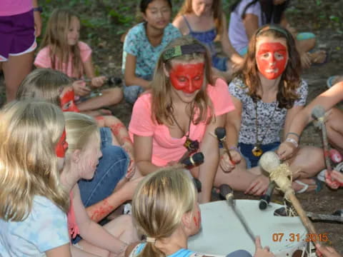 a group of children with face paint
