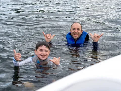 a person and a boy in the water