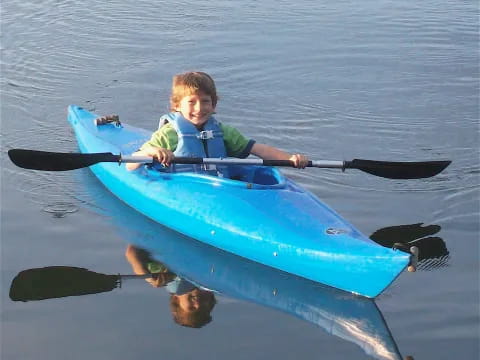 a boy in a kayak