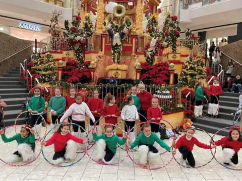 a group of people posing for a photo in front of a decorated building