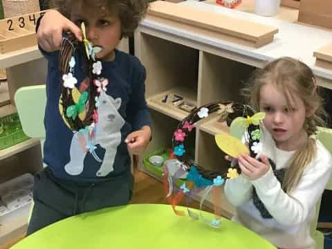 a boy and girl playing with toys