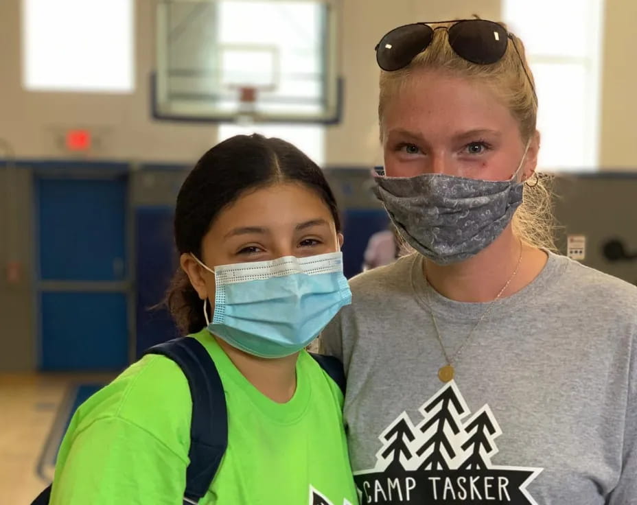 a person and a girl wearing face masks