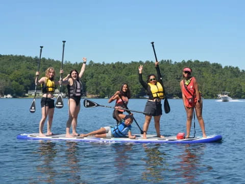 a group of people on paddle boards