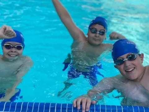 a group of people in a pool