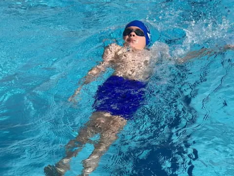 a man swimming in a pool