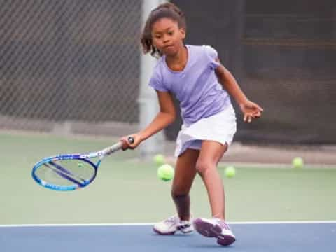 a girl playing tennis