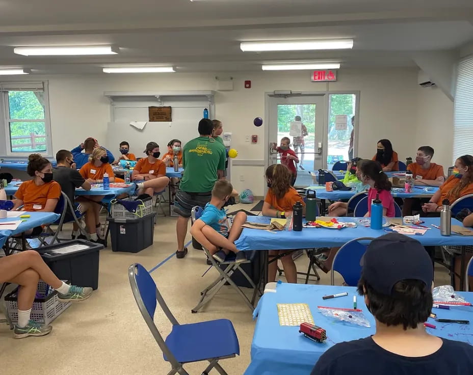 a group of people sitting at tables