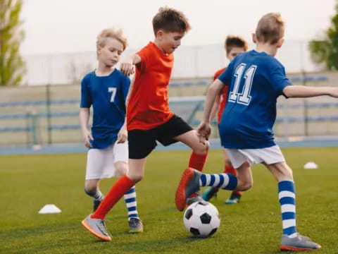 a group of boys playing football