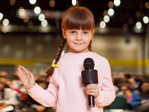 a girl holding a microphone