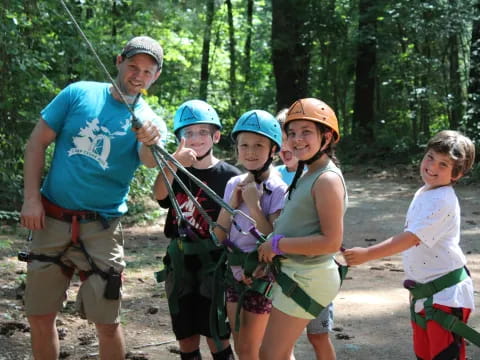 a group of people wearing helmets and holding sticks