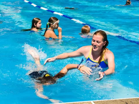 a group of women in a pool