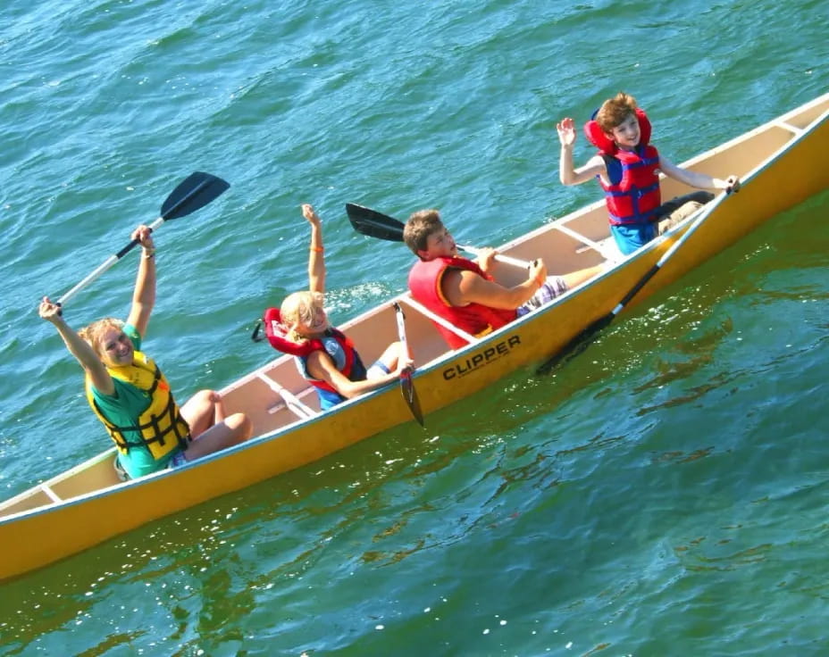 a group of people in a canoe