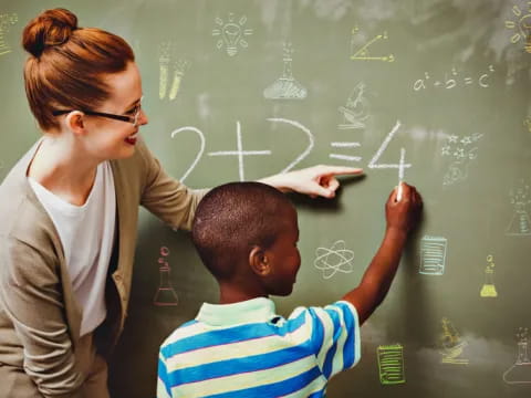 a teacher teaching a student