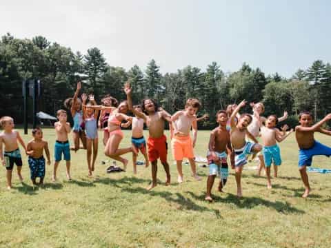 a group of boys jumping in the air