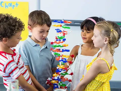 a group of children looking at a book