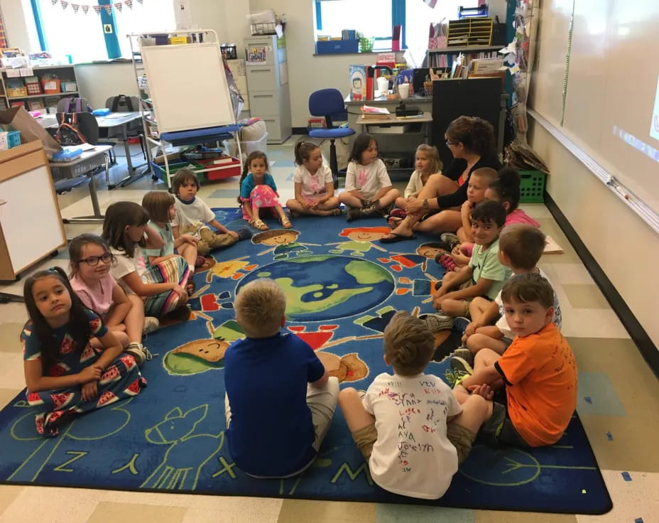 a group of children sitting on the floor