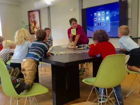 a group of people sitting around a table