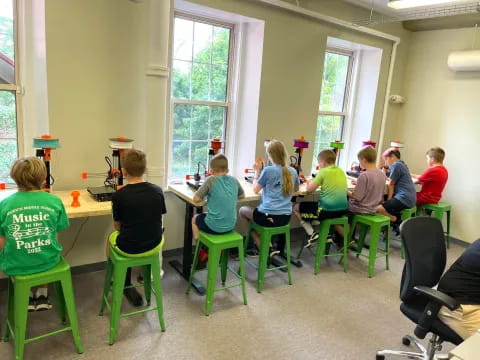 a group of people sitting at a table