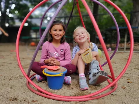 two girls in a play structure