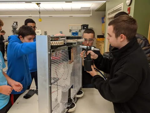 a group of people looking at a camera