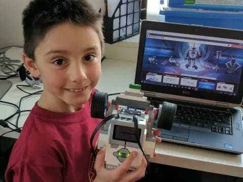 a boy holding a toy gun