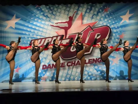 a group of women dancing on a stage