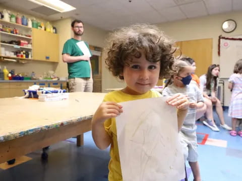 a child holding a toy