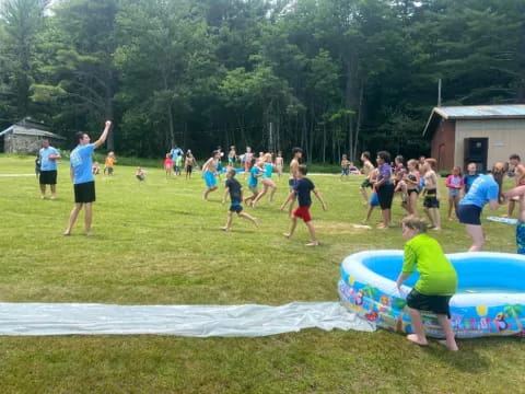 a group of people playing in a field