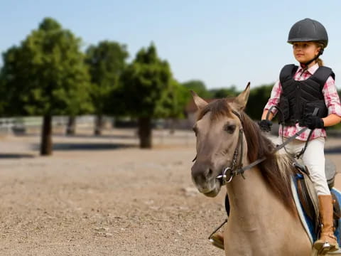 a girl riding a horse