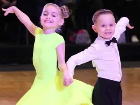 a boy and girl dancing