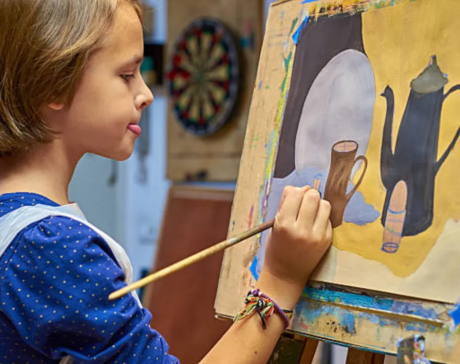 a young girl painting