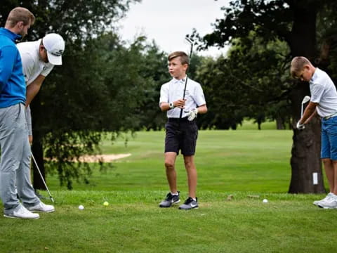 a group of people playing golf