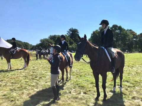 a group of people on horses